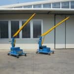 Electric crane for handling molds in the tire production sector.