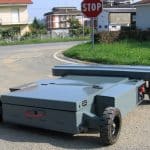 Radio-controlled trolley for handling industrial materials.